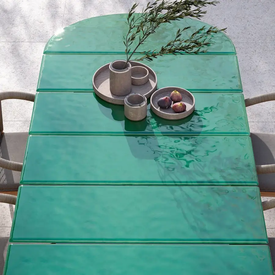Distinguished Atmosphera Materia table crafted with vibrant teal glass and a solid Asian Teak double base with a glossy finish