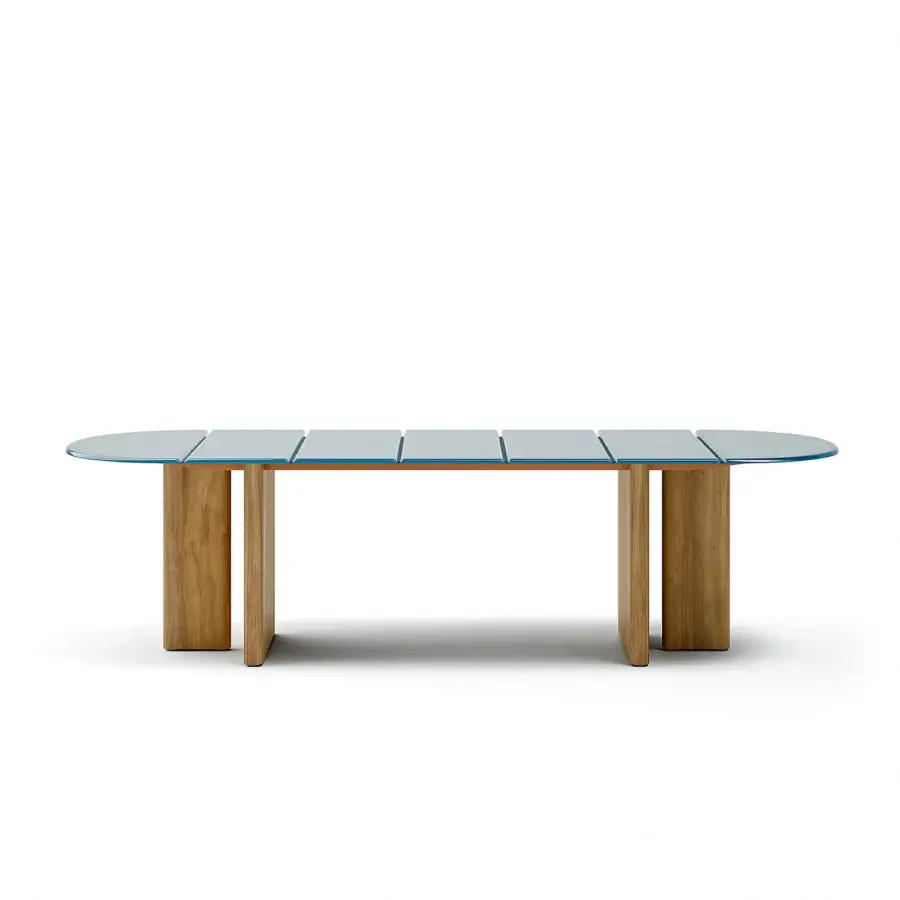 Innovative Atmosphera Materia table built with muted blue glass and a satin Asian Teak base showcasing natural grain