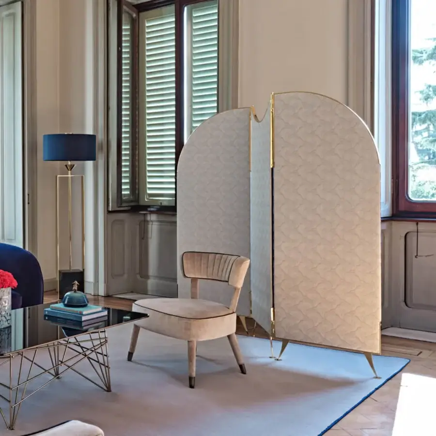 Distinguished Black Tie Aliseo room divider built with textured neutral beige fabric and refined gold-tone metal frame