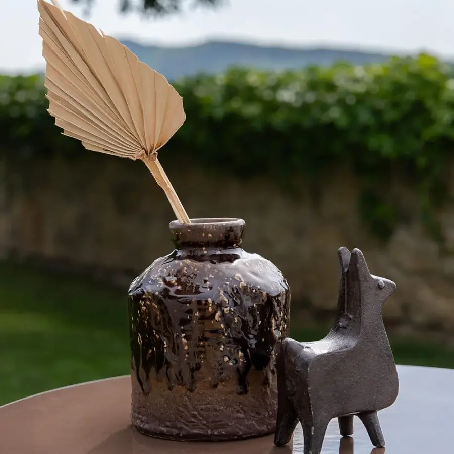 Handcrafted Atmosphera Materia side table with sculpted Asian Teak base and glossy glazed dark chocolate lava stone tabletop