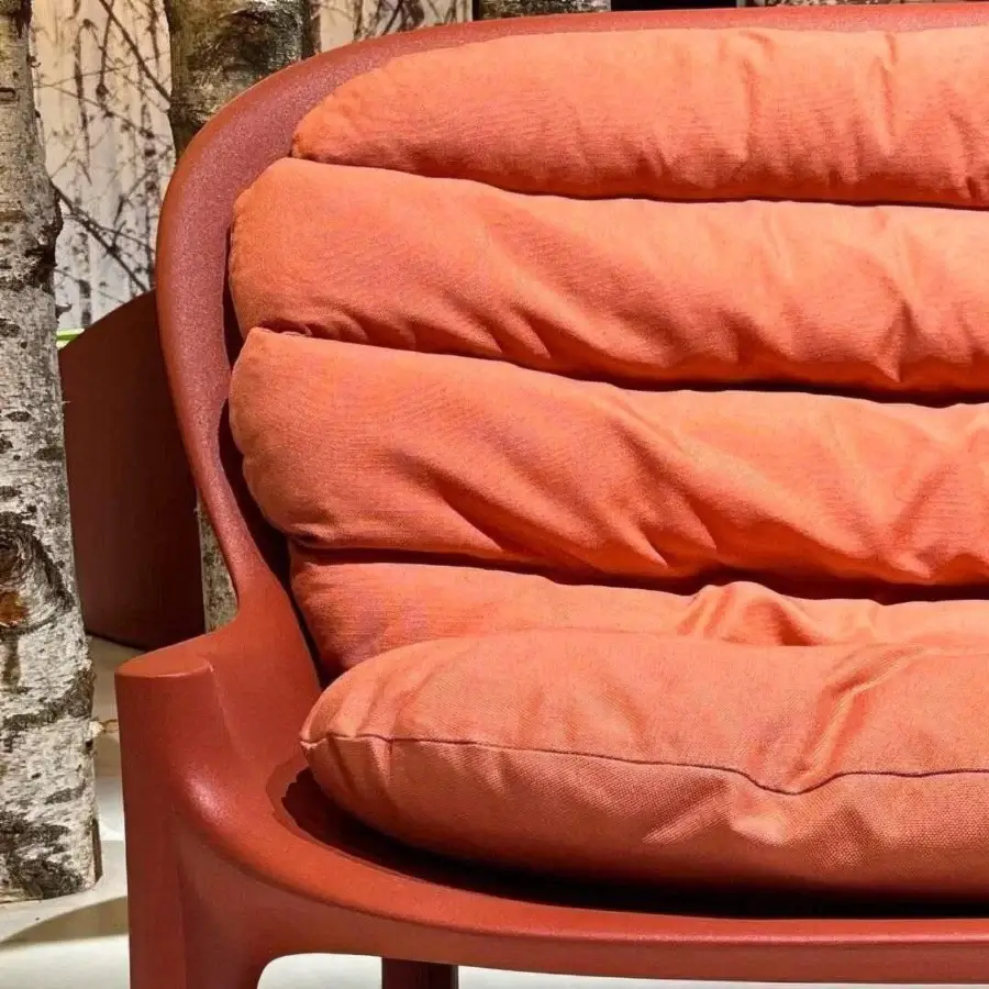 Distinguished Serralunga Balzac sofa with a generously curved form crafted in terracotta orange LLDPE with a matte finish