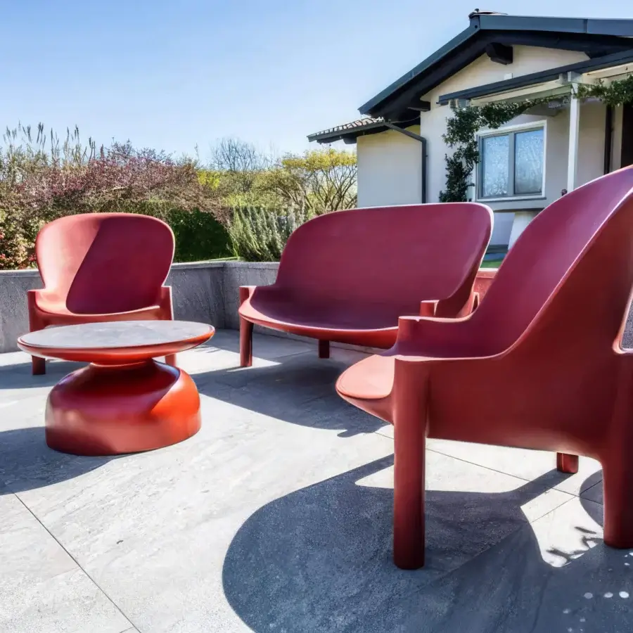 Distinguished Serralunga Balzac sofa with a curved silhouette crafted in muted red LLDPE and smooth matte finish