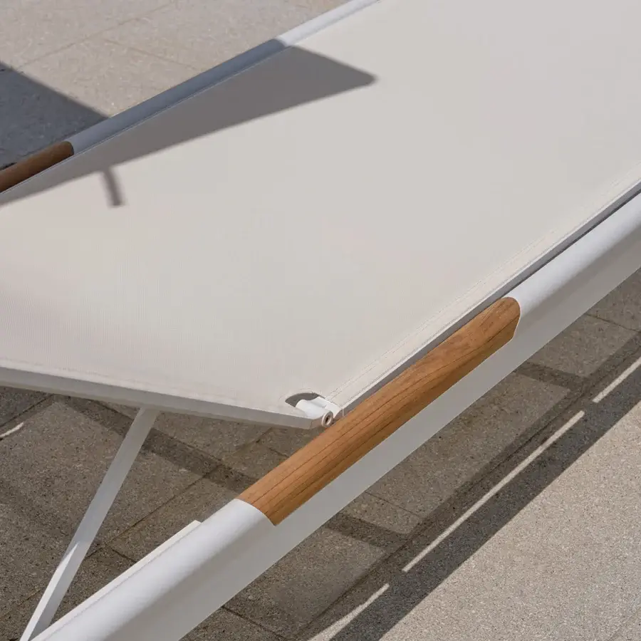 Captivating Atmosphera Nevada chaise lounge built with matte white aluminum, warm teak and light beige woven fabric
