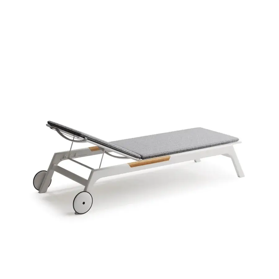 Distinguished Atmosphera Nevada chaise lounge with a sleek matte white aluminum frame and warm teak accents