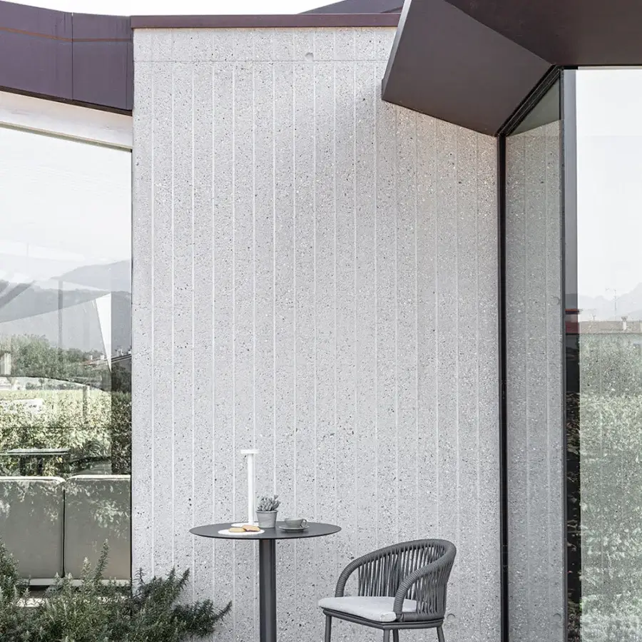 Elegant Atmosphera Pleasure stool crafted with a dark graphite aluminum frame and light gray woven high-performance fibers