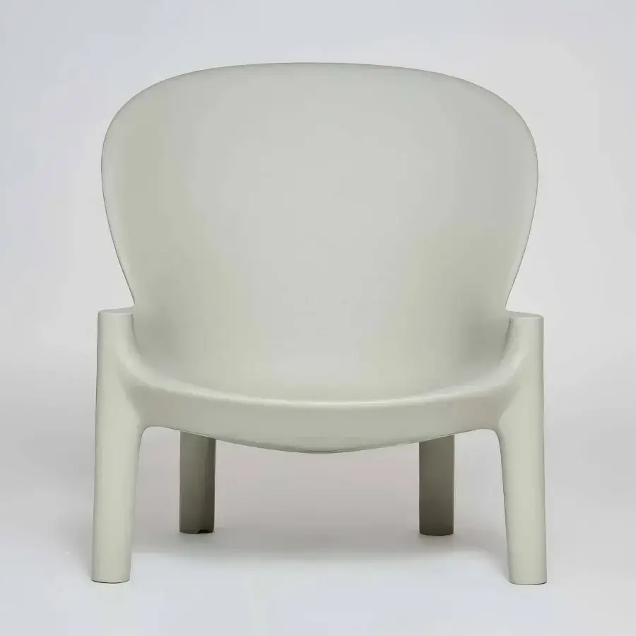 Elegant Serralunga Balzac lounge chair with rounded form built in pale grey-green recyclable LLDPE and uniformly matte finish
