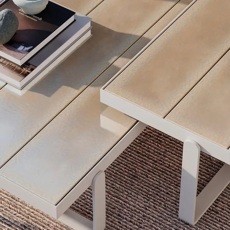Distinguished Atmosphera Capri coffee table with light neutral lava stone slats and solid aluminum base crafted with a glossy finish