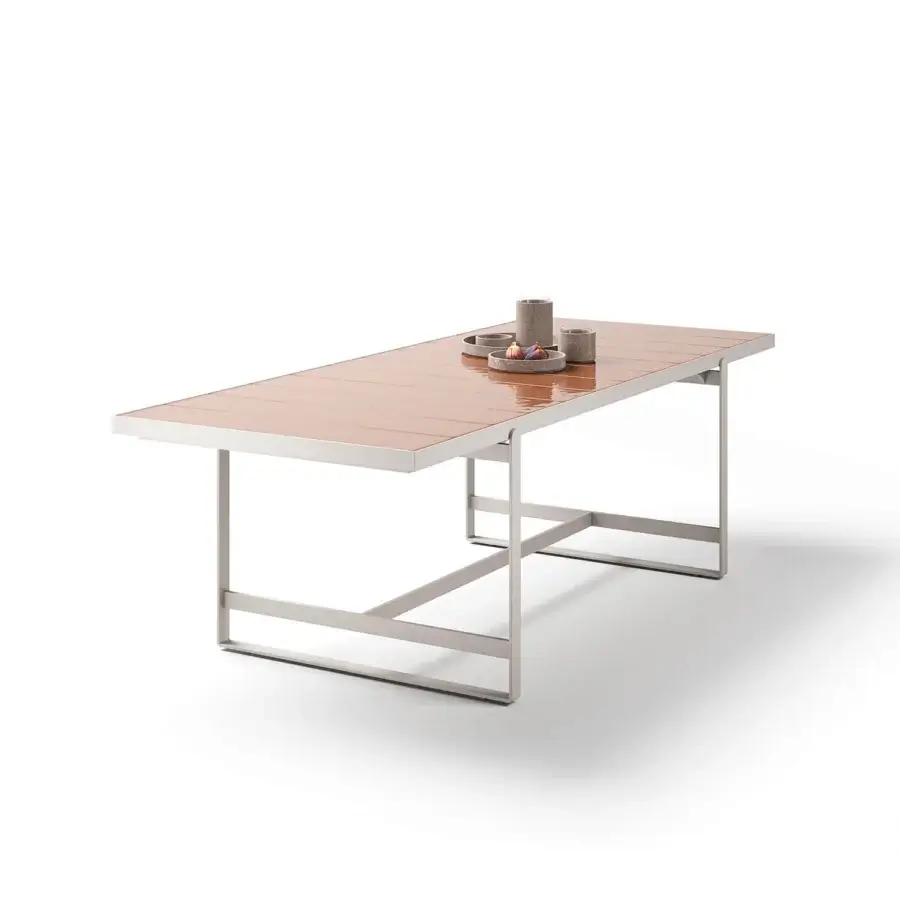 Superior Atmosphera Capri table with a rhythmic textured surface in warm brown glazed lava stone and solid aluminum base