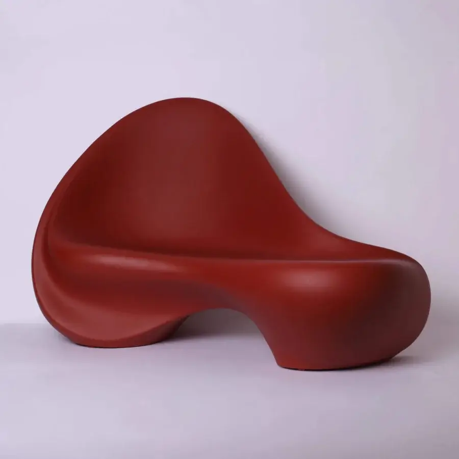 Distinguished Serralunga Ripple sofa crafted in reddish-brown LLDPE with a smooth matte lacquered finish embodies flowing curves and understated elegance