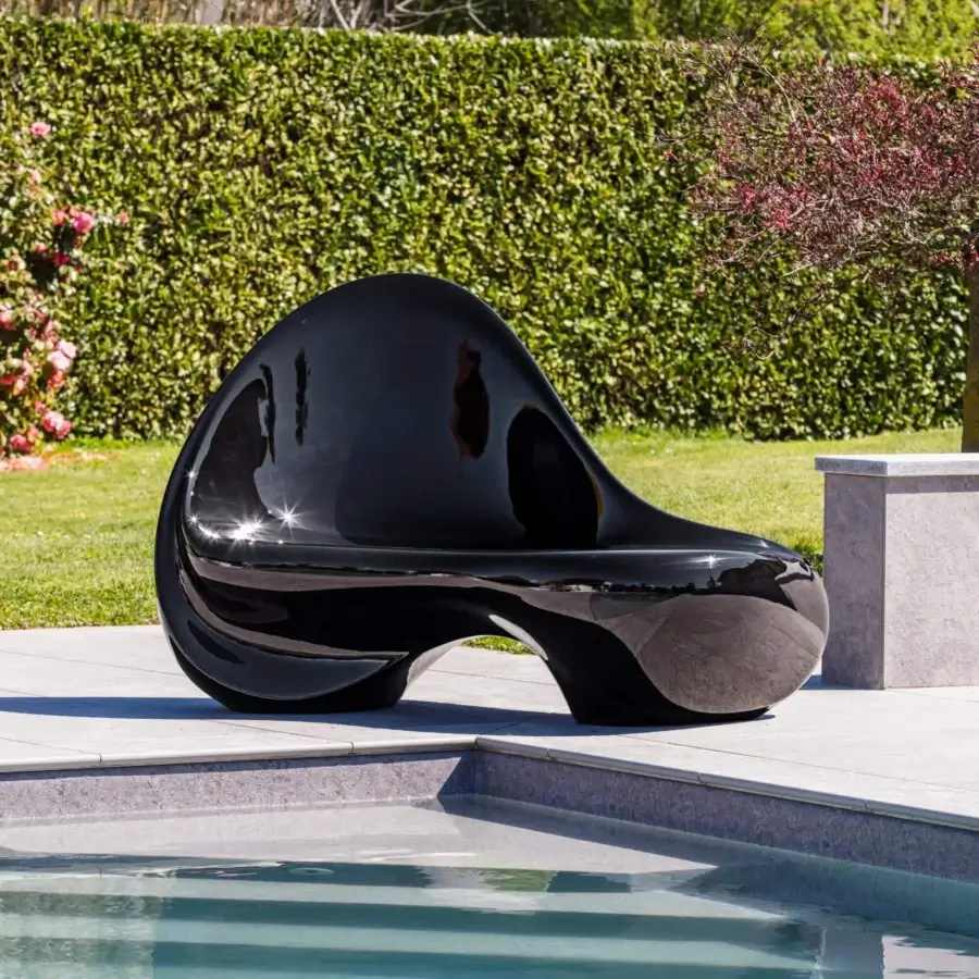 Captivating Serralunga Ripple sofa sculpted from durable LLDPE with a glossy black lacquered finish offering a fluid form