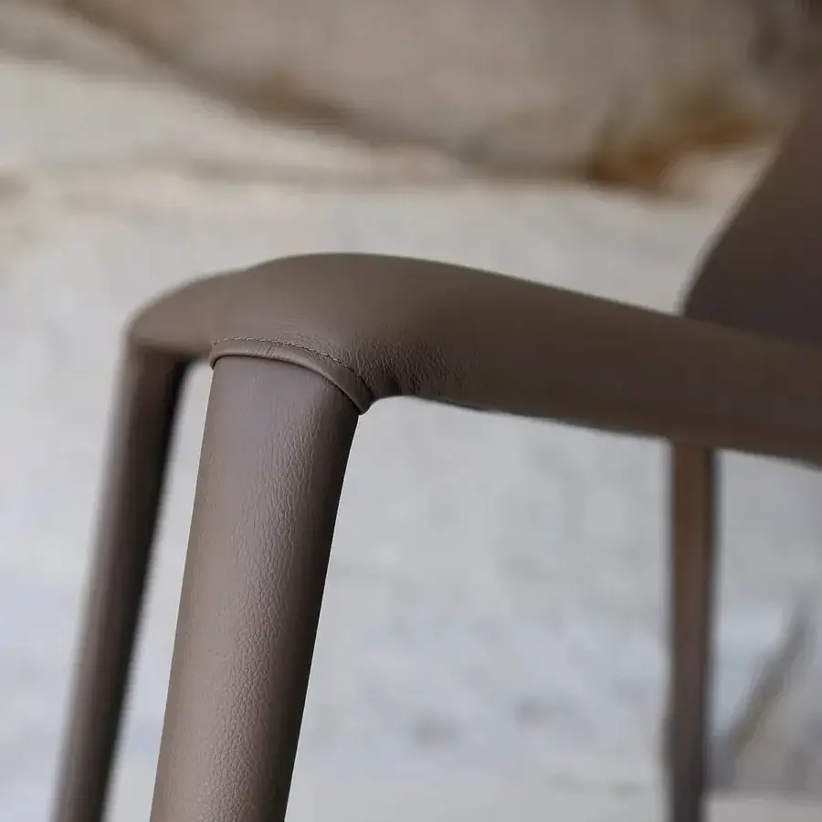 Elegant Ivano Antonello Italia Olivia dining chair in taupe real leather with seamless armrests and refined steel frame