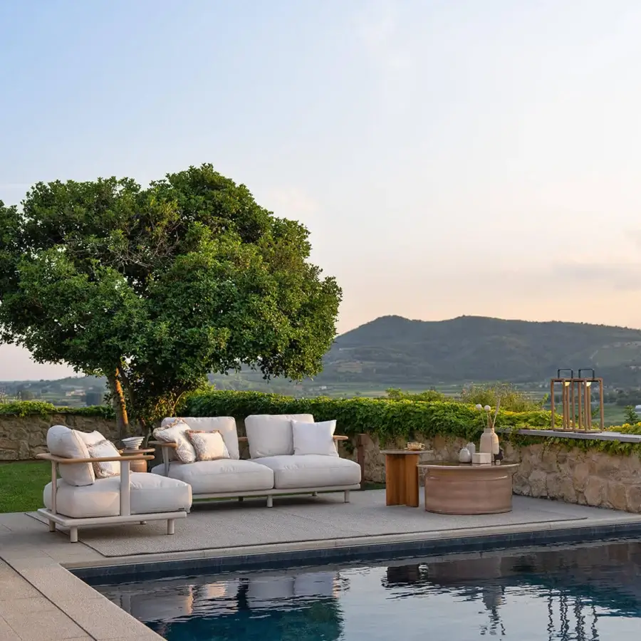 Distinguished Atmosphera Bliss lounge chair with aluminum in Gesso finish and white outdoor upholstery with patterned cushions