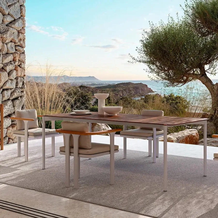 Distinguished Atmosphera Bliss armchair with warm teak armrests and light beige cushions in a Gesso finish