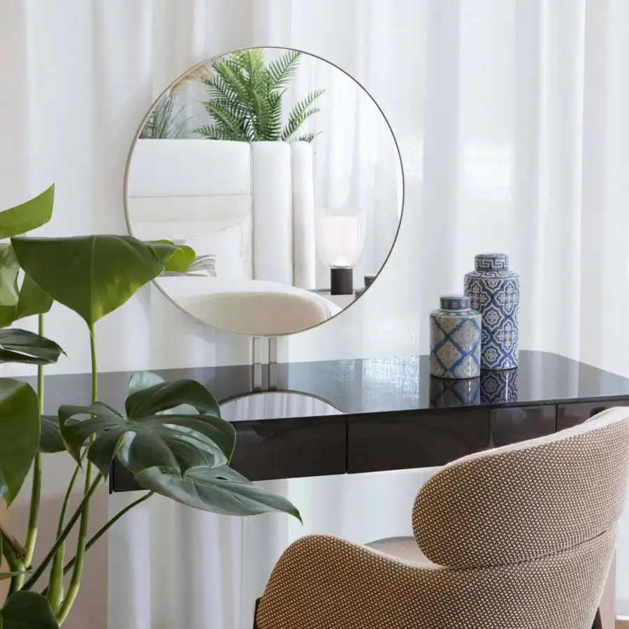 Exceptional Capital Dafne armchair with comfortable textured beige textile and satin sheen wooden legs