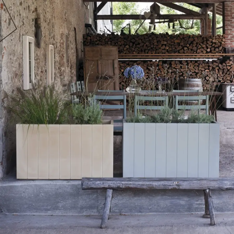 Elegant Serralunga Fence planter, a planter crafted in pale beige and muted light gray LLDPE plastic with a matte finish