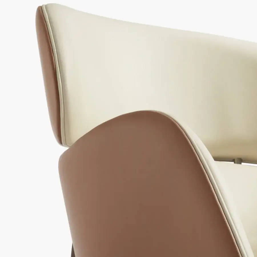 Distinguished Capital Dafne lounge chair with enveloping form upholstered in pale beige and warm light brown with a solid wooden frame