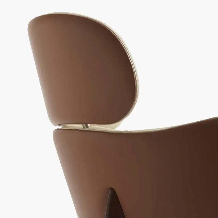 Exceptional Capital Dafne lounge chair with curved design upholstered in warm brown coated fabric with creamy beige detailing
