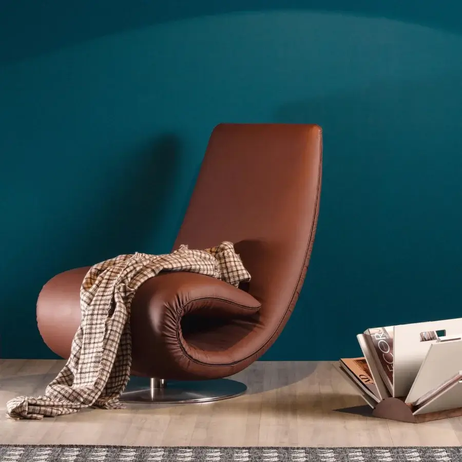 Superior Tonin Casa Ricciolo lounge chair to chaise crafted in dark brown leather with a flowing contemporary form