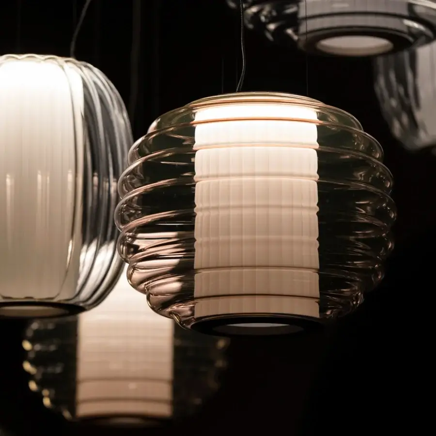 Elegant Contardi Alma suspension lamp crafted in blown glass with pleated fabric and glossy transparent finish