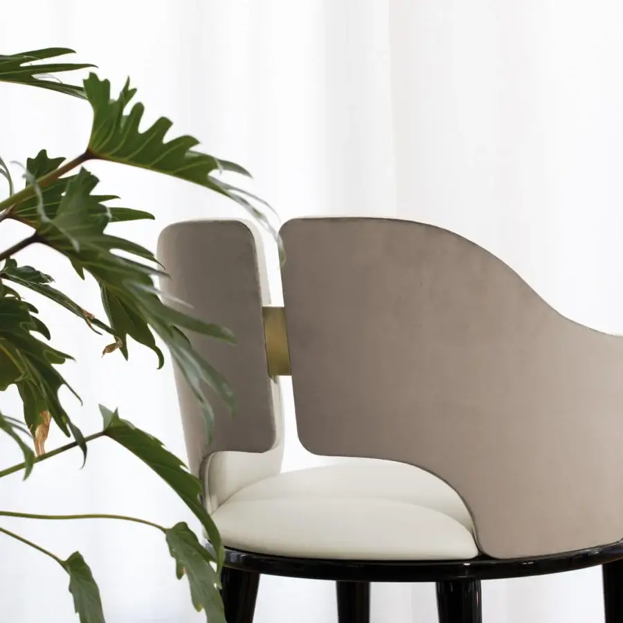 Distinctive Capital Augusta armchair crafted with muted gray textile and a light beige seat, built with glossy wood legs and metallic insert
