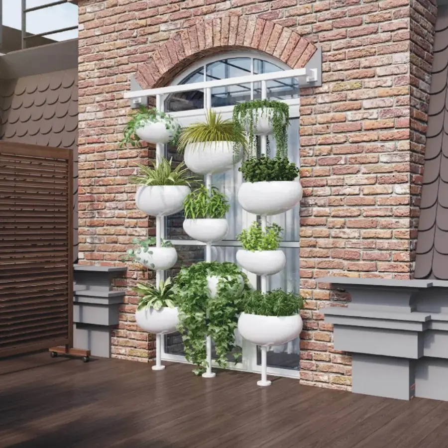 Elegant Serralunga Greenpills vertical planter crafted in recyclable LLDPE with a glossy white finish