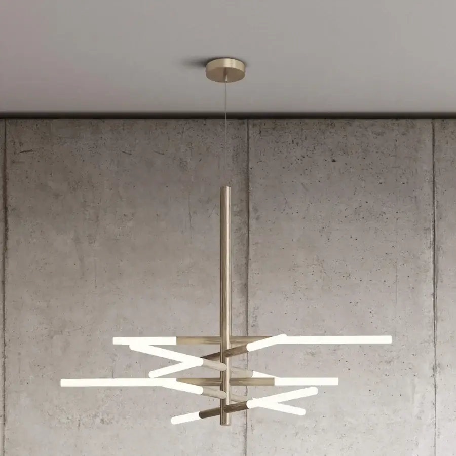 Elegant Contardi Bianca suspension lamp with snowflake-inspired design in metal and brushed brass finish emitting balanced light