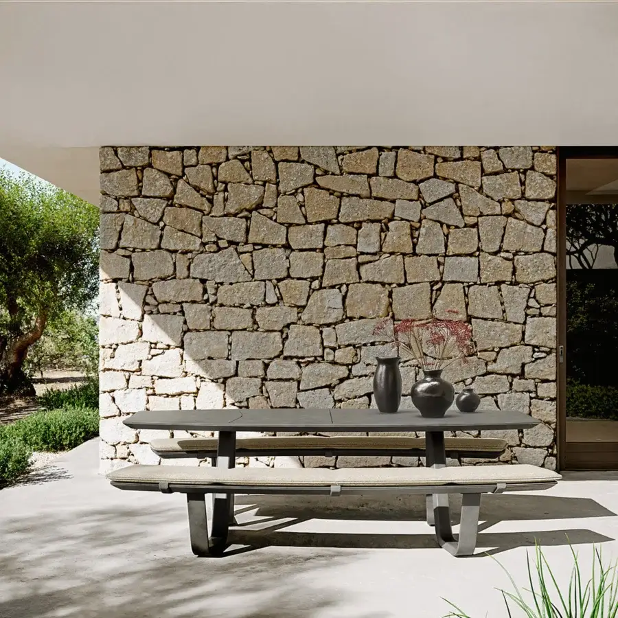 Sophisticated Atmosphera 8Teen table with benches crafted with concrete base and smooth dark gray tabletop embodying minimalist aesthetics