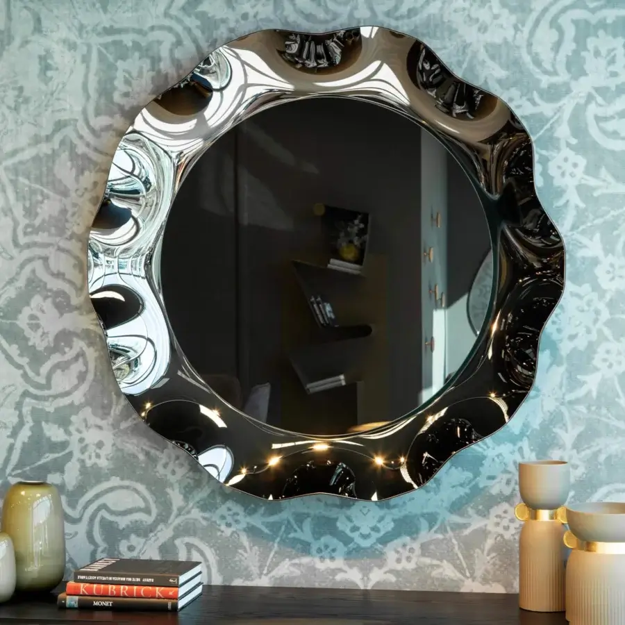 Elegant Tonin Casa Dorian mirror with corolla-shaped frame crafted in silvered curved glass enriched with bronze and fumè tones