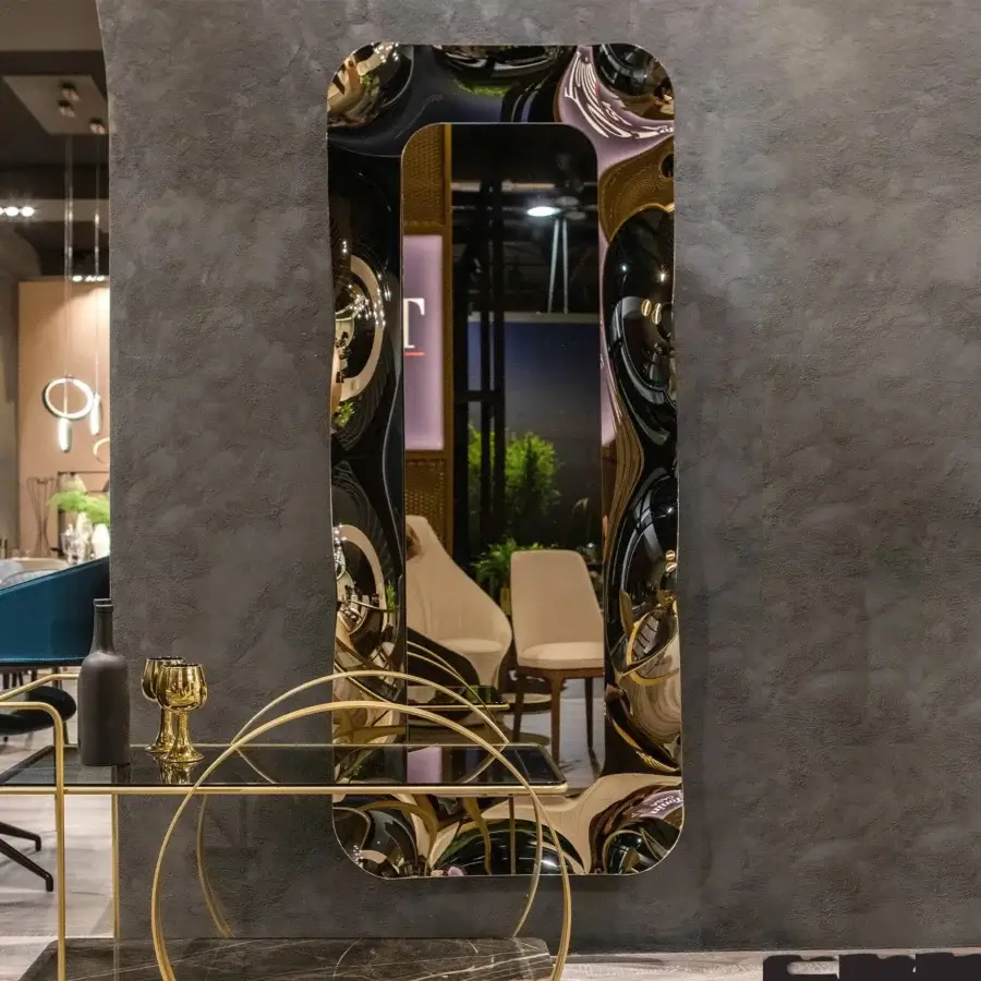 Distinguished Tonin Casa Dorian mirror with corolla-shaped frame crafted in silvered curved glass with bronze and fumè tones and glossy gold finish