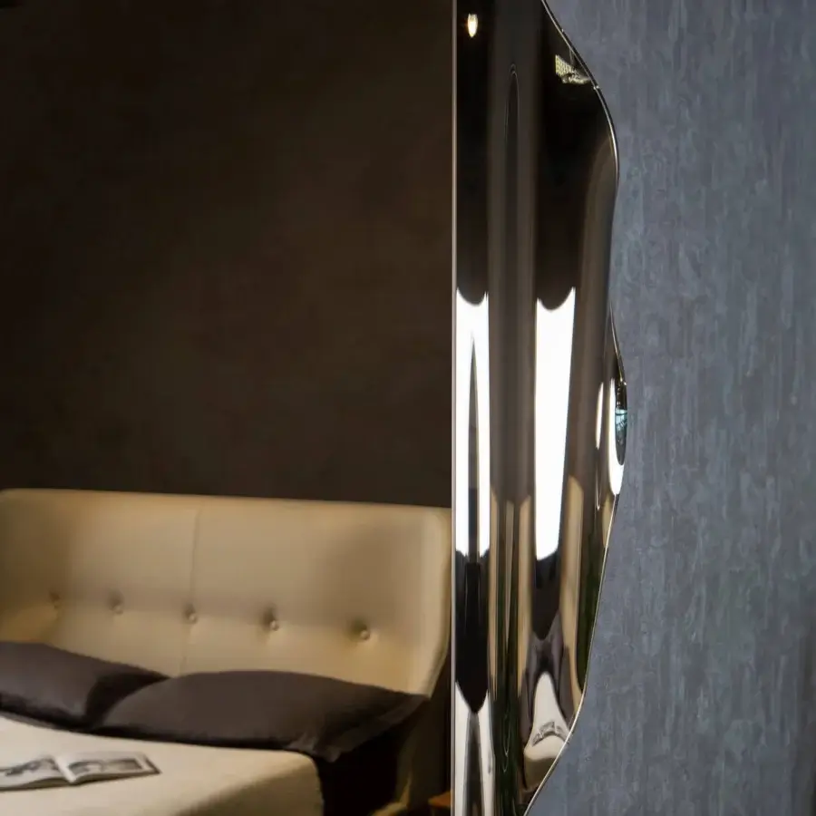 Distinguished Tonin Casa Anemos mirror with a highly reflective glass surface and dark synthetic backing in a satin tone finish
