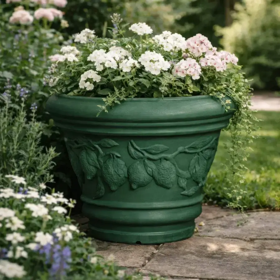 Elegant Serralunga Decorati Limoni planter with rounded form and lemon detailing crafted in dark green recyclable LLDPE with matte finish