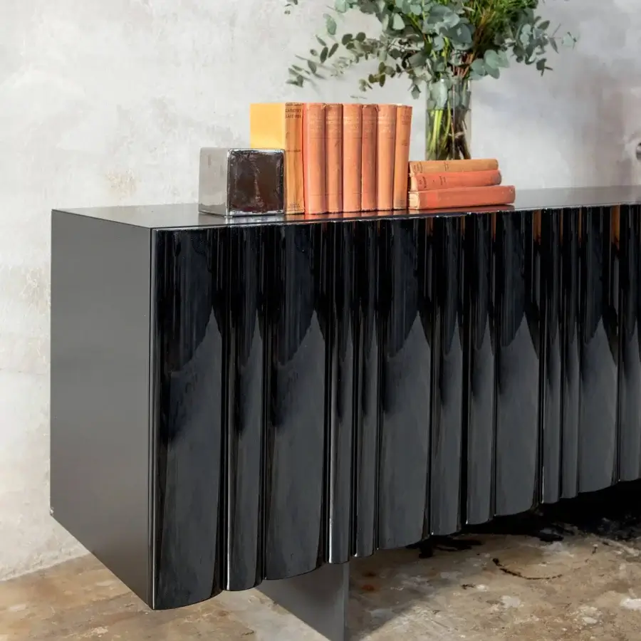 Distinguished Tonin Casa Bombé sideboard crafted in matte black lacquered wood with glossy black slats and reddish-brown undertones exhibiting a high-gloss finish