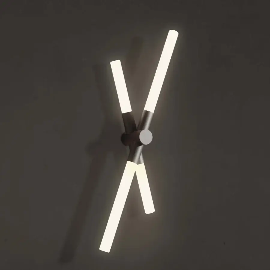 Architectural Contardi Bianca wall lamp with dark bronze metal and milky white glass emitting a balanced warm white glow