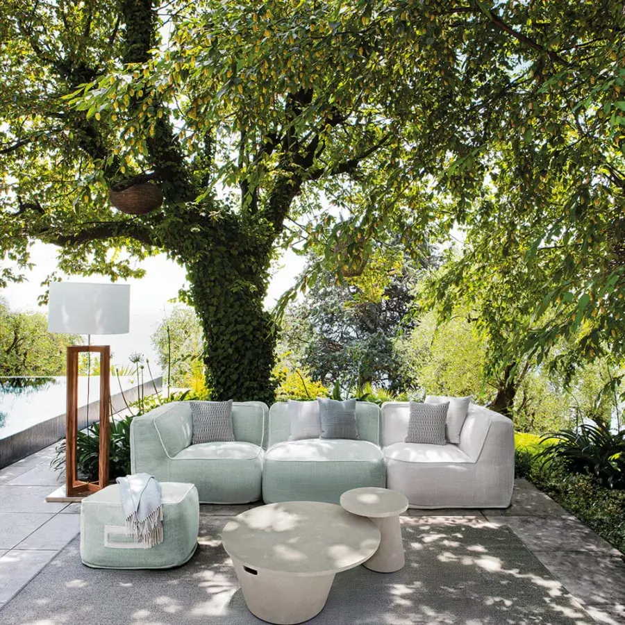 Sophisticated Atmosphera Totem coffee table crafted in neutral beige concrete with smooth flowing lines and a minimalist finish