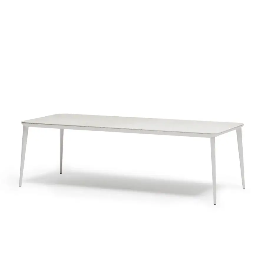 Elegant Atmosphera Origami table with folded silhouette and durable gres porcelain stoneware tabletop in matte white aluminum