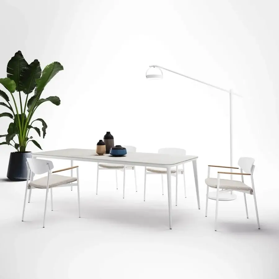 Elegant Atmosphera Origami table with folded silhouette and resilient gres porcelain stoneware in a light gray matte finish