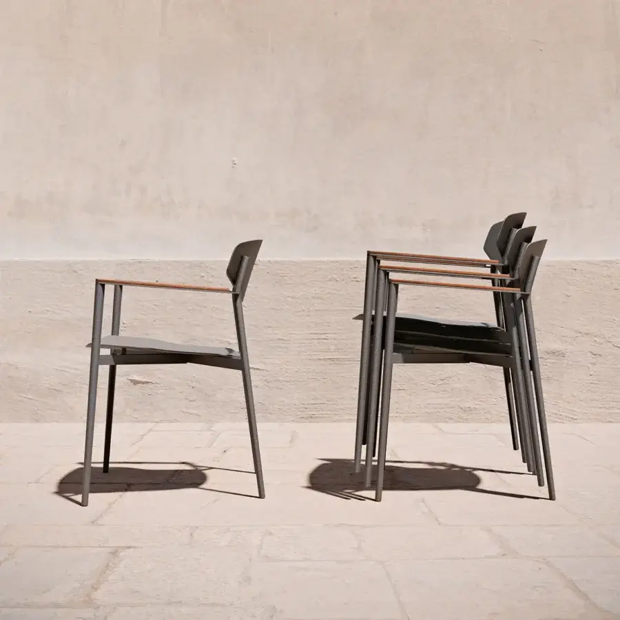 Superior Atmosphera Origami armchair with a dark gray aluminum shell and warm natural teak armrests