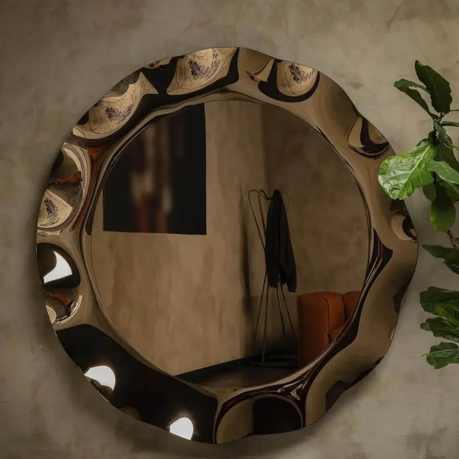 Distinctive Tonin Casa Dorian mirror crafted in silvered curved glass with bronze and fumè tones exhibiting a fluid finish