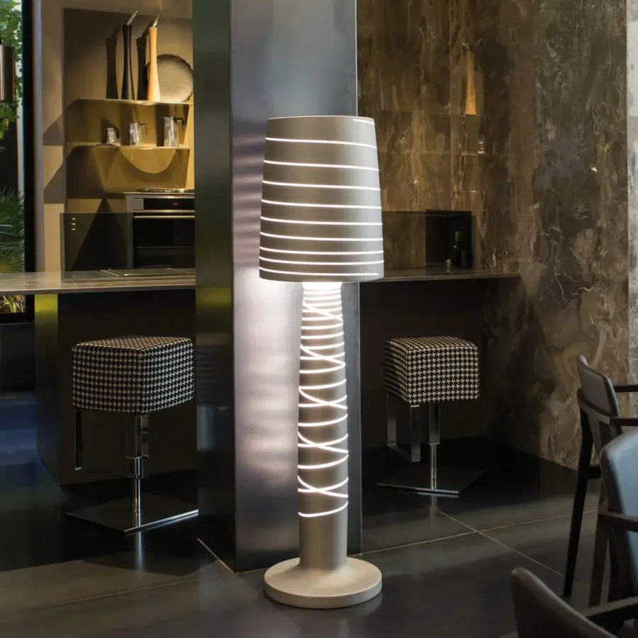 Elegant Serralunga Miss Jane & Lady Jane floor lamp sculpted in light gray LLDPE with a lacquered engraved finish
