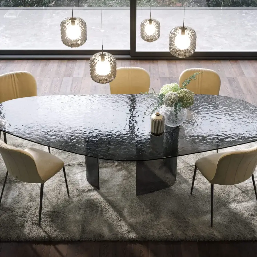 Superior Tonin Casa Ablos table crafted in smoky gray hammered glass with an angular base and sculpted form