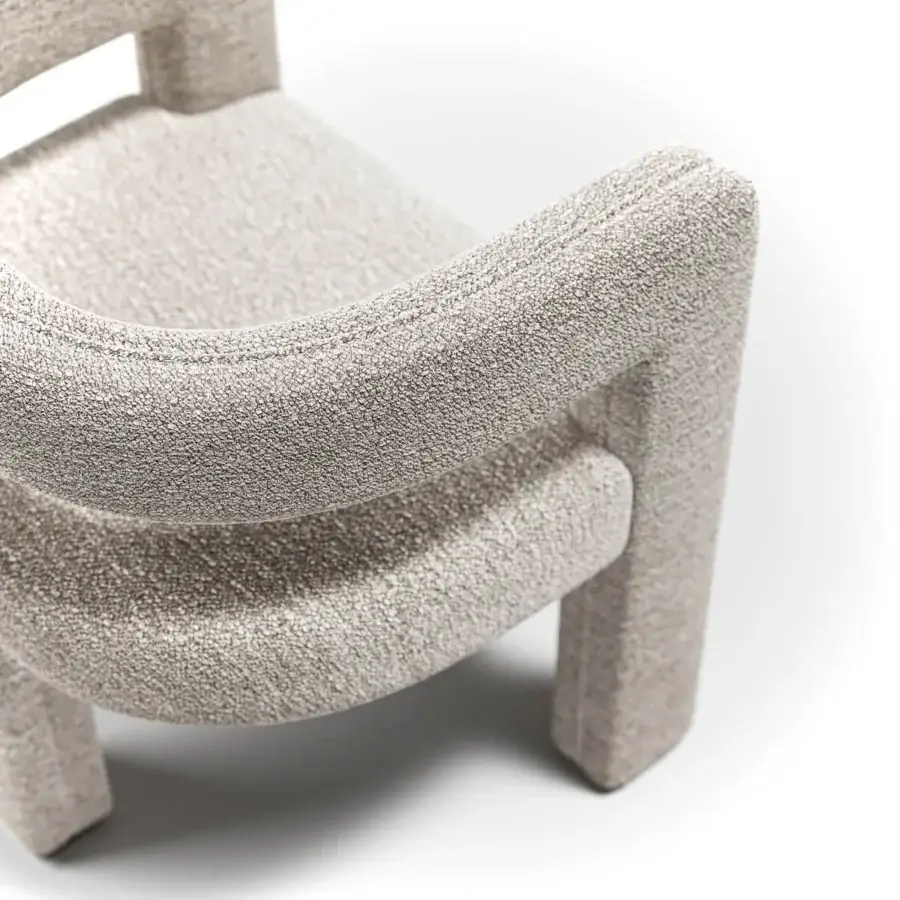 Exceptional Capital Mirage armchair with continuous flowing silhouette and neutral beige textured fabric upholstery crafted with delicate metal accents