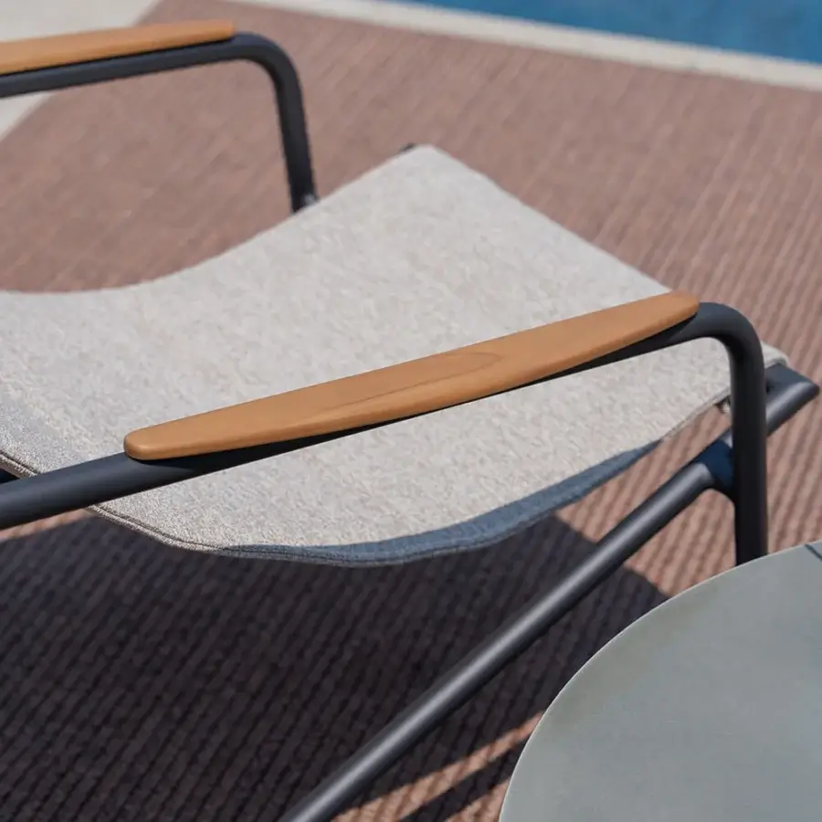 Sophisticated Atmosphera Zante lounge chair with a dark gray aluminum frame and warm medium-brown wooden armrests in beige textilene