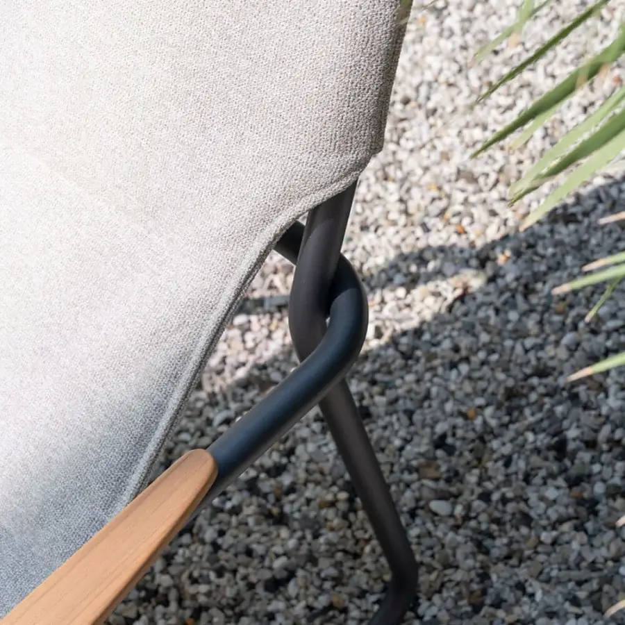 Sophisticated Atmosphera Zante lounge chair with a dark gray aluminum frame, light wood armrests and textured light gray textilene construction