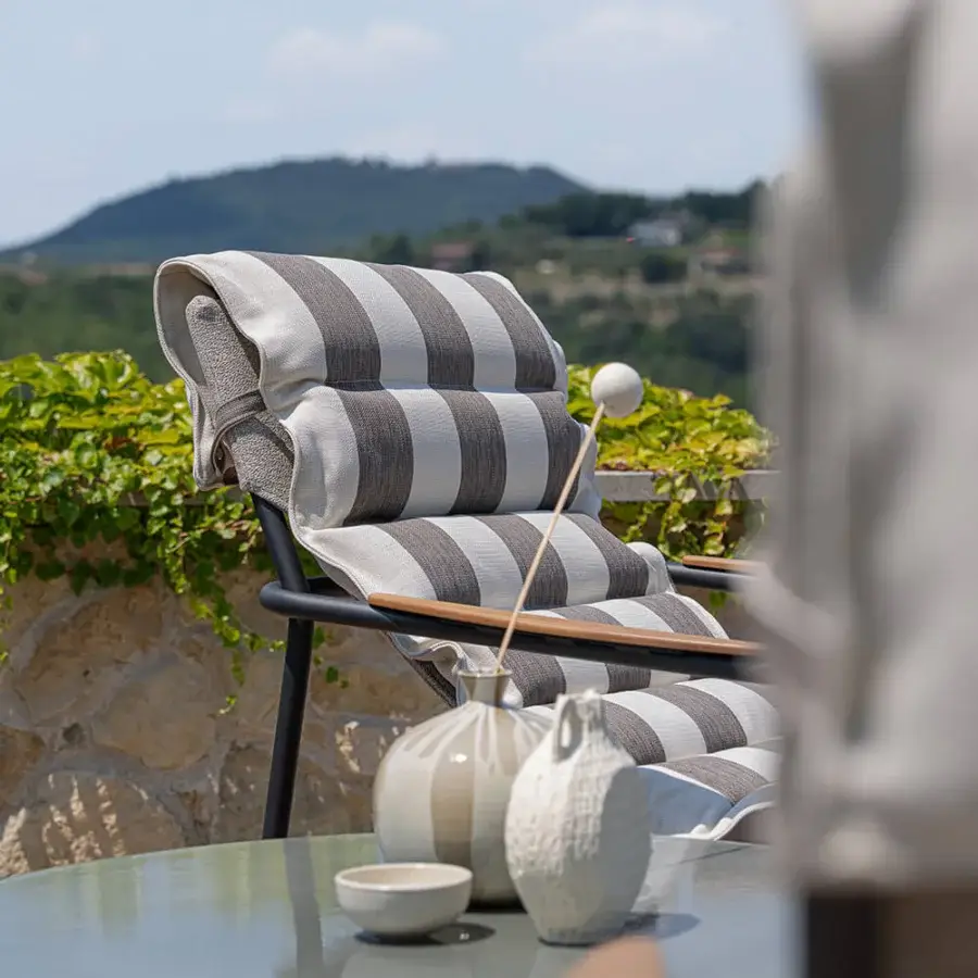 Superior Atmosphera Zante padded lounge chair with breathable textilene and plush grey and white striped fabric cushioning with a dark matte aluminum frame