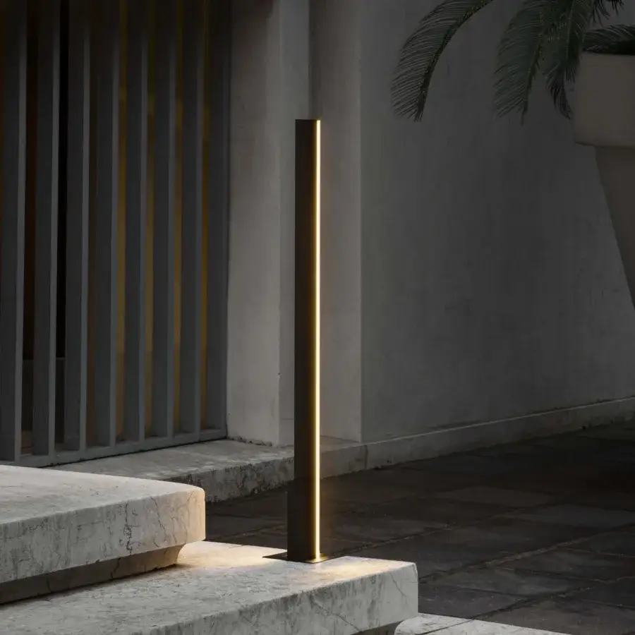 Distinguished Contardi Fly Outdoor floor lamp crafted in dark gray metal with a matte finish emitting a warm vertical glow