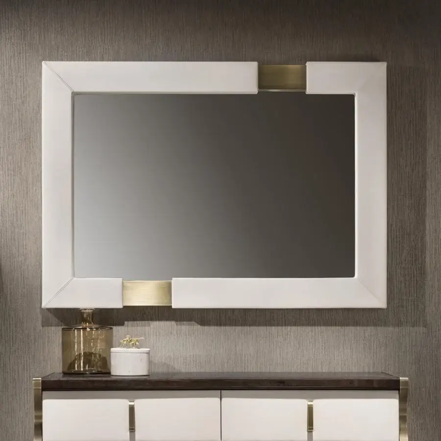 Distinctive Capital Trilogy mirror crafted in matte white wood with golden metal inserts for a harmonious design