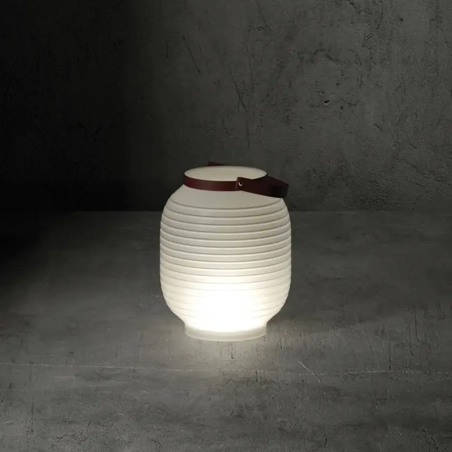 Innovative Serralunga Honey Lantern, portable lighting crafted in neutral translucent LLDPE plastic with reddish-brown leather handle