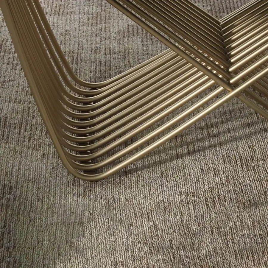 Sophisticated Tonin Casa Tenso table with a woven steel base and tempered glass top in muted gold tone with satin finish