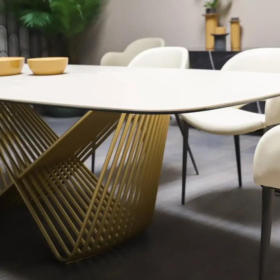 Exceptional Tonin Casa Tenso table crafted with a travertino barrel tabletop and interwoven golden steel base with a polished finish