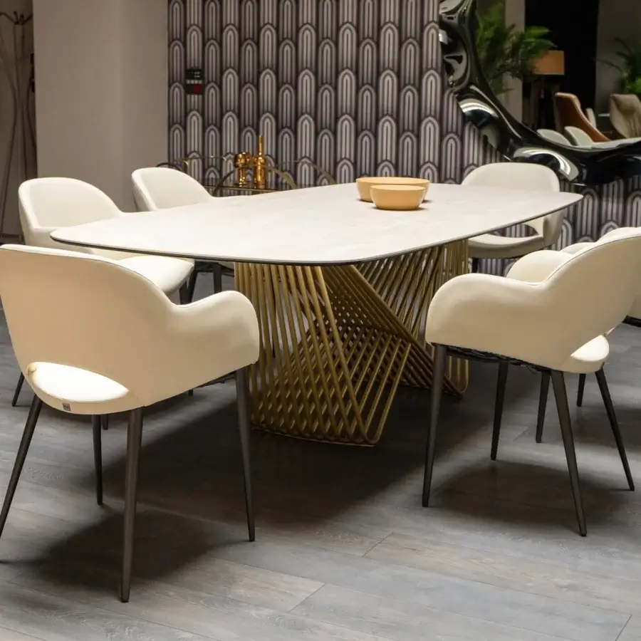 Distinguished Tonin Casa Tenso table with light beige ceramic tabletop and golden-toned painted steel sculptural base